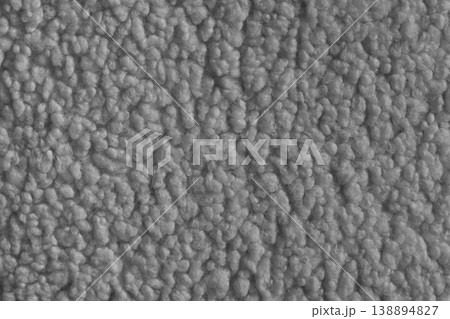 Gray color soft faux fur cloth texture with fluffy plush surface for cozy fabric backgrounds 138894827
