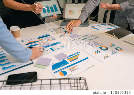 business team working on a project in the office or reviewing and discussing a business project. business team working on a project in the office or reviewing and discussing a business project. 138895319