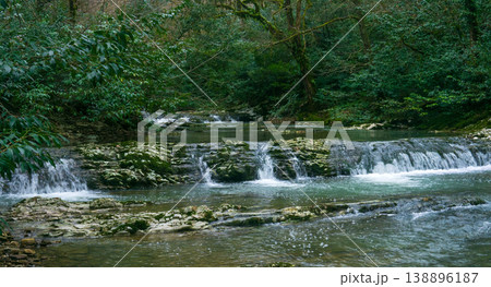 cascade of waterfalls in mountain forest cascade of waterfalls in mountain forest 138896187