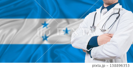 Honduras healthcare concept. Male doctor on Honduras flag. Doctor with crossed arms on Honduras flag Honduras healthcare concept. Male doctor on Honduras flag. Doctor with crossed arms on Honduras flag 138896353