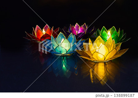 Vesak day. Floating colorful lotus candles glowing on water surface 138899187