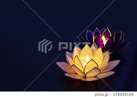 Vesak day. Floating lotus candle lanterns illuminating dark water at night 138899189