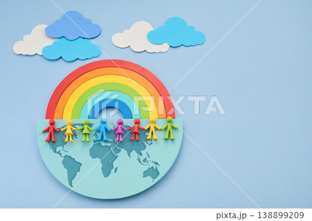 Diverse people holding hands on world map under rainbow Diverse people holding hands on world map under rainbow 138899209