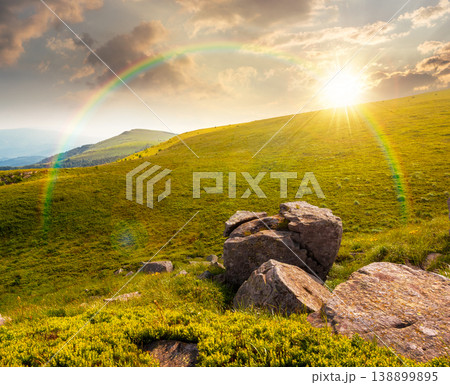 sunset over mountain summer landscape. meadow with giant stones among the grass on the hillside. awe view near the peak of mountain smooth in evening dappled light. great outdoors. weather with sunset over mountain summer landscape. meadow with giant stones among the grass on the hillside. awe view near the peak of mountain smooth in evening dappled light. great outdoors. weather with 138899895