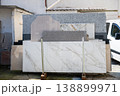 Marble and granite stone slabs display in outdoor construction materials yard 138899971