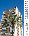 Modern apartment building with palm tree against clear blue sky in Barcelona 138899972