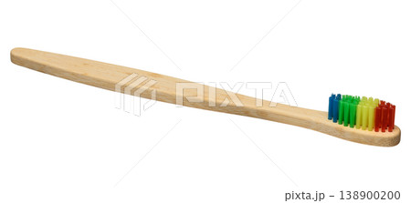 Bamboo toothbrush with bright multi-colored bristles isolated on background Bamboo toothbrush with bright multi-colored bristles isolated on background 138900200