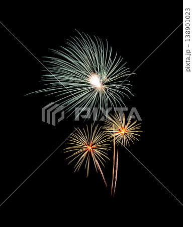 Green and yellow fireworks exploding on black sky Green and yellow fireworks exploding on black sky 138901023