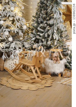 Wooden Rocking Horse in Cozy Christmas Interior with Snowy Trees Wooden Rocking Horse in Cozy Christmas Interior with Snowy Trees 138902134