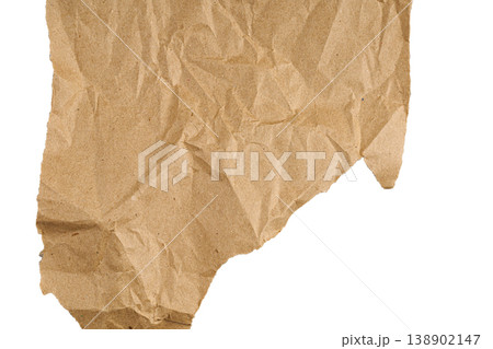 Crumpled brown kraft paper texture isolated on white background. Ripped recycled paper sheet. Crumpled brown kraft paper texture isolated on white background. Ripped recycled paper sheet. 138902147