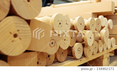 Various wooden dowels stacked in a workshop for woodworking tasks by carpenters Various wooden dowels stacked in a workshop for woodworking tasks by carpenters 138902171