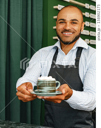 Barista serving a cup of coffee at a cafe in the morning Barista serving a cup of coffee at a cafe in the morning 138902173