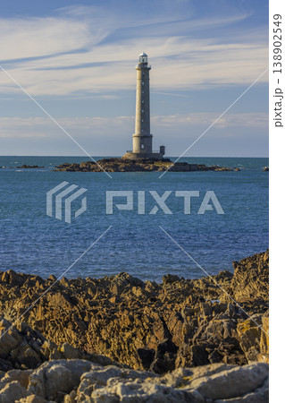 Gatteville lighthouse standing tall above rocky coastline in Normandy, France 138902549