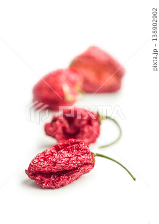 Dried Red Chili Peppers On White Background. Spicy Ghost Pepper Food Ingredient 138902902