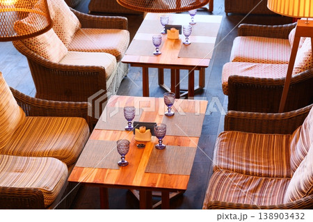 Chic arrangements with ambient lighting and fine utensils Chic arrangements with ambient lighting and fine utensils 138903432