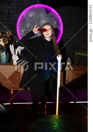 Individual woman exuding confidence amid lively artistic environment Individual woman exuding confidence amid lively artistic environment 138903531