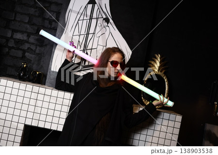 Dynamic performer dressed with luminous neon and trendy eyewear Dynamic performer dressed with luminous neon and trendy eyewear 138903538