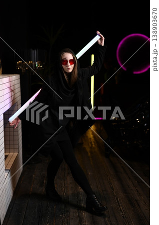 An animated silhouette illuminated by vibrant neon amid urban landscape 138903670