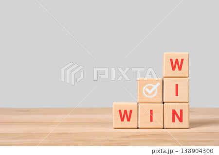 Wooden blocks with word win. Concept of collaboration and partnership leading to success. Strategy and business concept 138904300