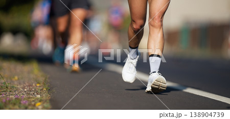 Marathon running race, people feet on city road, runners run urban marathon in the the city Marathon running race, people feet on city road, runners run urban marathon in the the city 138904739