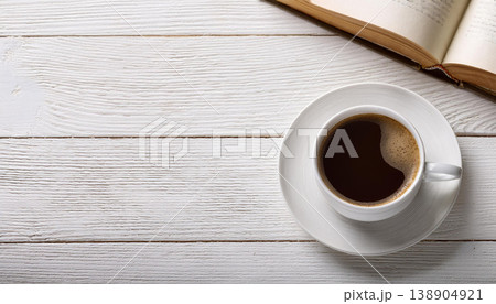 Cup of Black Coffee and Open Book on White Wooden Table , Morning Reading Routine Cup of Black Coffee and Open Book on White Wooden Table , Morning Reading Routine 138904921