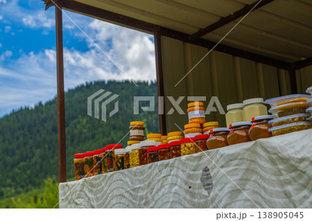 Jars of Honey, Jam, and Preserves at Outdoor Market Stall in mountainous Kyrgyzstan Jars of Honey, Jam, and Preserves at Outdoor Market Stall in mountainous Kyrgyzstan 138905045