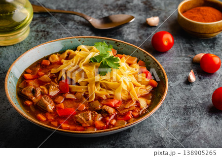 Lagman soup with lamb, homemade noodles and vegetables. Lagman soup with lamb, homemade noodles and vegetables. 138905265