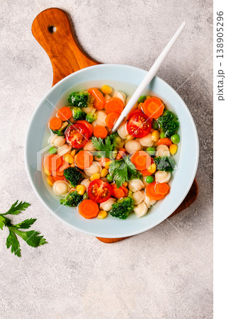 Soup with mini dumplings and vegetables. 138905296