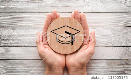 Education and Learning Concept , Graduation Cap Icon Held in Hands Education and Learning Concept , Graduation Cap Icon Held in Hands 138905576