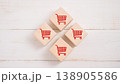 E-Commerce and Shopping Concept , Red Cart Icons on Wooden Blocks 138905586