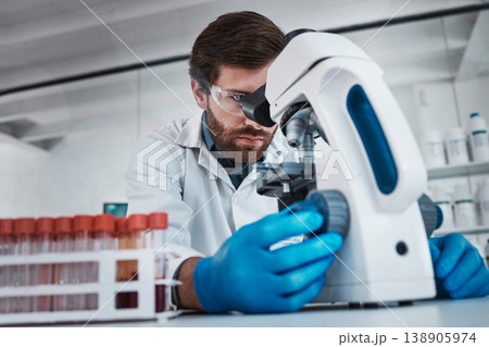 Working in laboratory, man studying chemical dna in test tube and research scientific biotechnology in Germany. Pathology scientist, liquid solution and microscope focus on career in medical science Working in laboratory, man studying chemical dna in test tube and research scientific biotechnology in Germany. Pathology scientist, liquid solution and microscope focus on career in medical science 138905974