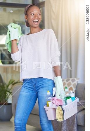 Cleaning, house work and black woman working in home service mopping living room, doing job with smile and happy to clean house apartment. Female cleaner or housewife housekeeping with happiness 138906003