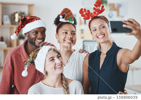 Christmas party, phone selfie and business people in celebration of festive holiday. Diversity, smile and happy work friends celebrating on 5g mobile, social media picture post or happy office memory Christmas party, phone selfie and business people in celebration of festive holiday. Diversity, smile and happy work friends celebrating on 5g mobile, social media picture post or happy office memory 138906039