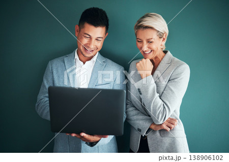 Laptop, collaboration and strategy with a business team in studio on a green background for planning. Computer, teamwork or management with a man and woman working on growth as company leadership 138906102