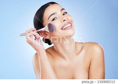 Makeup brush, beauty and portrait of woman with smile on blue background for cosmetics, powder and foundation. Skincare, facial and girl face with cosmetology tools for products, salon and treatment 138906513