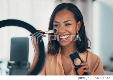 Beauty influencer, vlogger or podcast host teaching with a phone to film live stream makeup tutorial with blush makeup brush and palette. Happy woman use technology to promote cosmetic product online 138906832