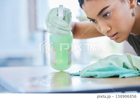 Clean, spray and woman cleaning a table at home for hygiene with a spray bottle product for fresh house. Housework, chores and face of female doing domestic cleansing with a cloth or rag on surface 138906856