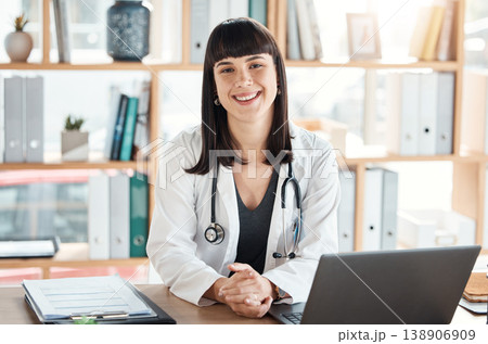 Doctor, portrait and smile of woman in hospital office ready for healthcare and wellness. Medical professional, health and happy female physician from Canada with laptop for research and telehealth. Doctor, portrait and smile of woman in hospital office ready for healthcare and wellness. Medical professional, health and happy female physician from Canada with laptop for research and telehealth. 138906909