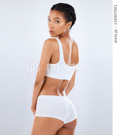 Health, body care and portrait of back of woman in underwear with healthy diet, exercise and balance in studio. Fitness, nutrition and skincare, beauty and slim fit figure isolated on grey background Health, body care and portrait of back of woman in underwear with healthy diet, exercise and balance in studio. Fitness, nutrition and skincare, beauty and slim fit figure isolated on grey background 138907001