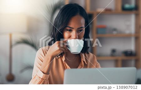 Thinking, planning and working from home on laptop while entrepreneur drinks coffee, tea or hot drink to help concentrate. Freelance blogger or writer with vision ideas, strategy and blog innovation 138907012