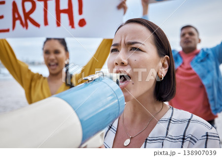 Asian woman, climate change and megaphone protest with crowd protesting for environment and global warming. Save the earth, activism and angry female shouting on bullhorn to stop beach pollution. Asian woman, climate change and megaphone protest with crowd protesting for environment and global warming. Save the earth, activism and angry female shouting on bullhorn to stop beach pollution. 138907039