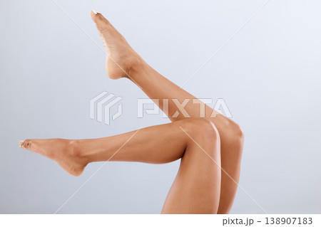 Legs, feet and skincare with beauty and woman, epilation and glow on studio background. Skin, pedicure and wellness for mockup with laser hair removal, waxing and dermatology with cosmetic care 138907183