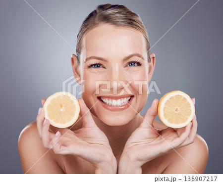Lemon skincare, woman and beauty for portrait, clean wellness and studio background. Happy model, face and citrus fruits for natural detox diet, facial nutrition and aesthetic dermatology Lemon skincare, woman and beauty for portrait, clean wellness and studio background. Happy model, face and citrus fruits for natural detox diet, facial nutrition and aesthetic dermatology 138907217