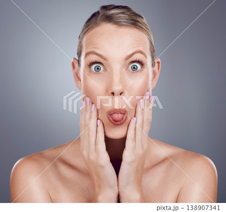 Skincare, beauty and portrait of woman with tongue out in studio for makeup, cosmetics and wellness. Female model, funny face and expression for facial aesthetic, glow and emoji on background 138907341