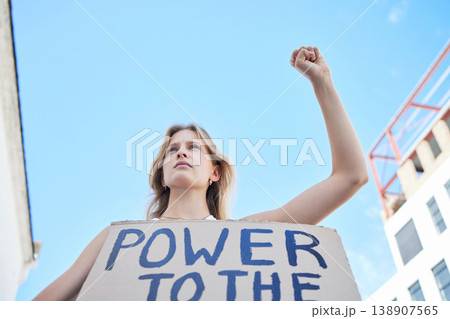 Power to the people, woman protest and freedom sign to fight human rights, justice and politics in street rally. Girl power, feminism revolution and poster to support equality, community and society 138907565