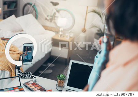 Fashion influencer, style vlogger or social media entrepreneur live streaming content online with her phone. Trendy freelancer recording or posting a video to her channel for viewers and subscribers 138907797