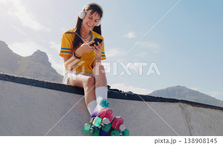 Smile, phone and music with woman and roller skates for skating, streaming and social media app. Technology, headphones and sports with girl in skate park for internet, mobile radio and fitness Smile, phone and music with woman and roller skates for skating, streaming and social media app. Technology, headphones and sports with girl in skate park for internet, mobile radio and fitness 138908145