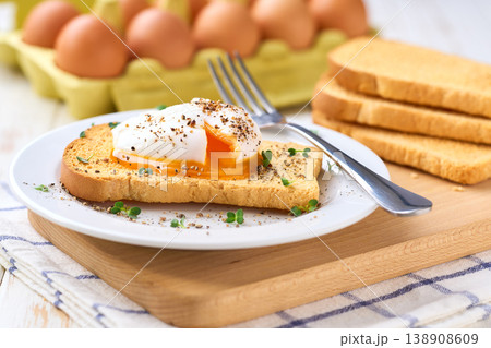 Poached egg with runny yolk and microgreens on a toasted bread for healthy breakfast . Healthy breakfast food concept. 138908609