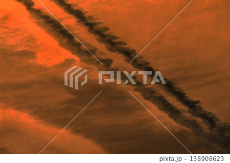 Traces airplane air trail jet line stripe sunset orange sky background 138908623