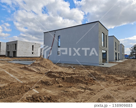 Row of unfinished houses built from white concrete blocks Row of unfinished houses built from white concrete blocks 138909883